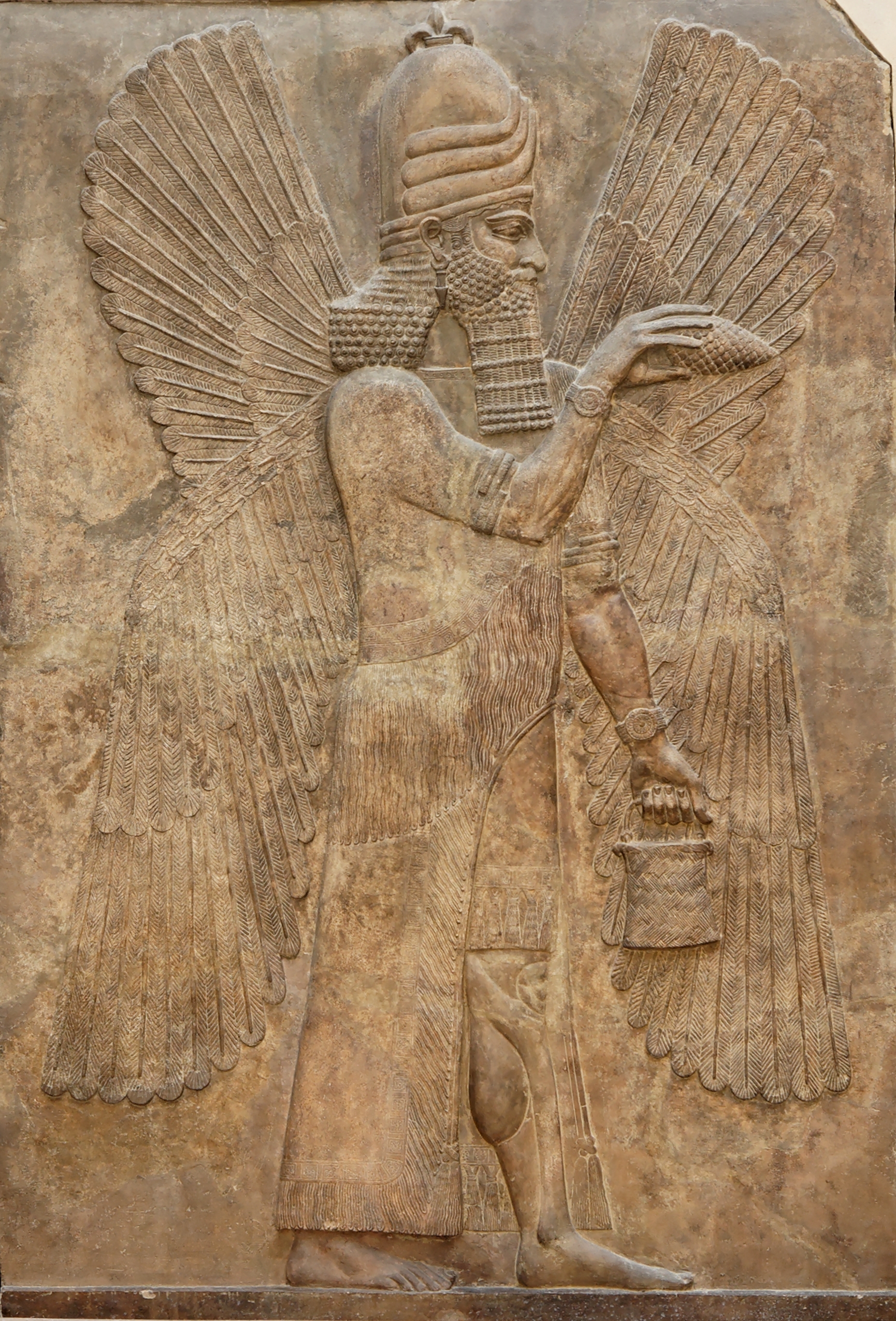 A god holding one of those handbag-and-pinecone ensembles. Relief from the north wall of the Palace of Sargon II at Dur Sharrukin, 713–716 BCE