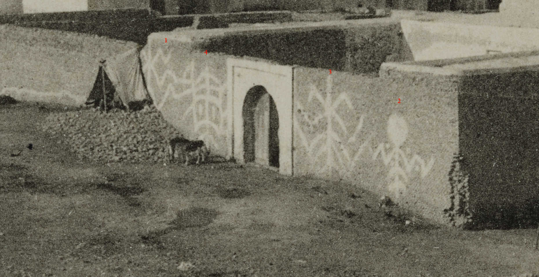 Detail of the outer wall of the Qayrawān mosque-complex, shewing paintings. From a postcard reproduced in full below. All images courtesy of William Gallois