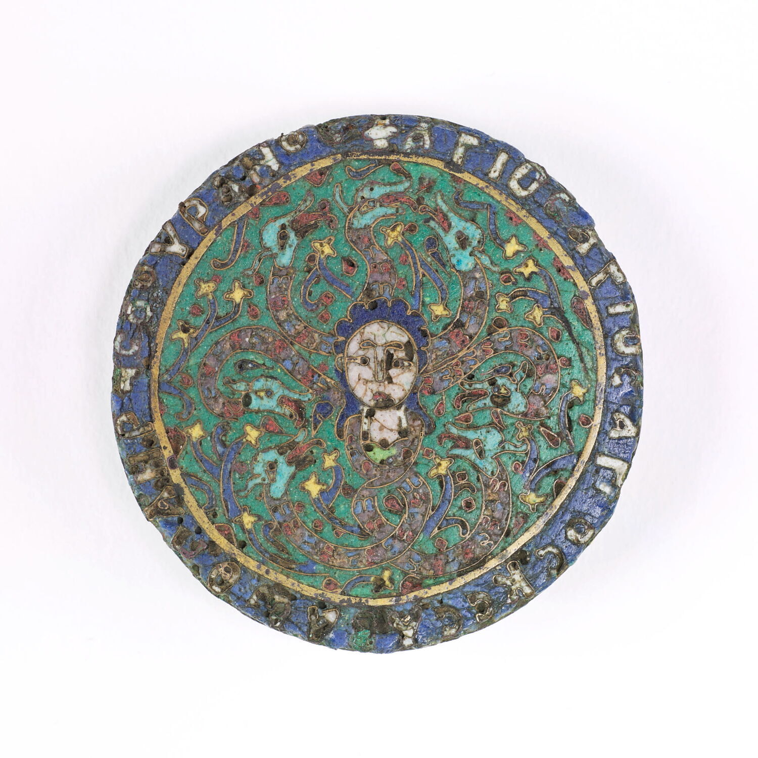 Anonymous twelfth-century enamel medallion from north-western Syria shewing a gorgon's head, with protective inscription on the reverse. Musée du Louvre, Département des Arts de Byzance et des chrétientés en Orient, OA 6276 - https://collections.louvre.fr/ark:/53355/cl010117588 - https://collections.louvre.fr/CGU